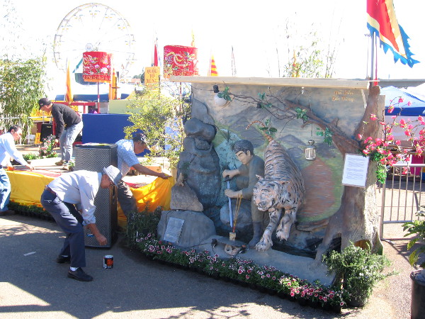 Guys work to get everything ready shortly after the gates open on Saturday.