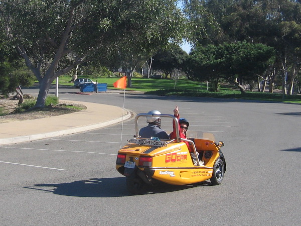 An enthusiastic greeting from tourist passing in a GoCar rental.