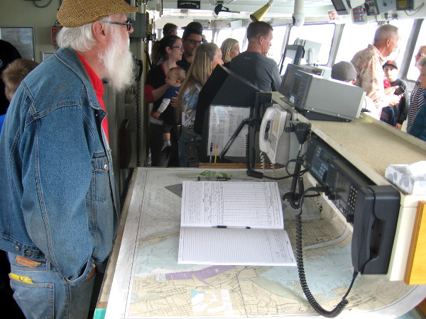 The ship's log is open on some navigational charts.