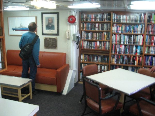 The library, lounge and study contain shelves of books and several interesting displays.