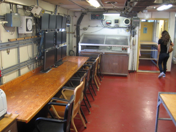 At the photo's center is a winch control. Video monitors help scientists visualize their work underwater.