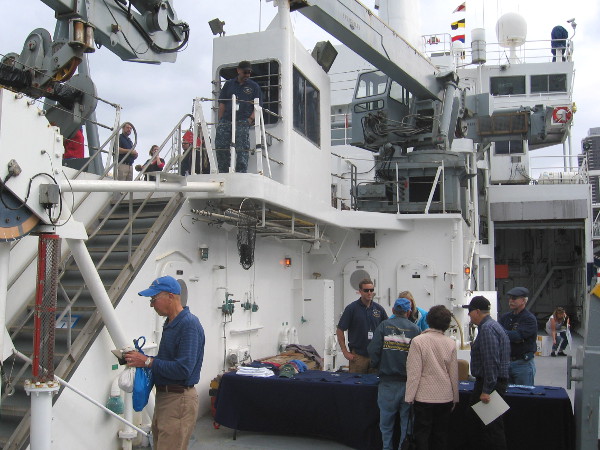 Heavy machinery available on the complex ship includes multiple winches, cables, cranes.