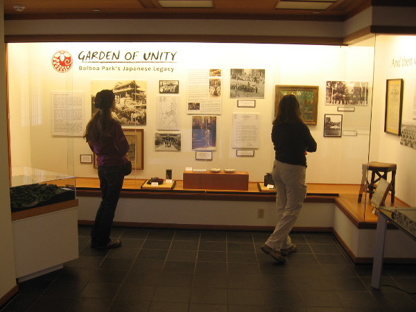 Visitors check out thought-provoking historical and cultural displays in the Exhibit House.