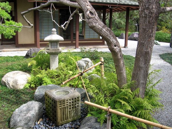 Oribe-doro lantern. Exhibit House with views of Karesansui (Dry Stone Garden) in background.