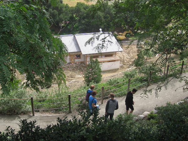 Looking down at a path that leads into canyon. New construction is a large pavilion that will open later this year.