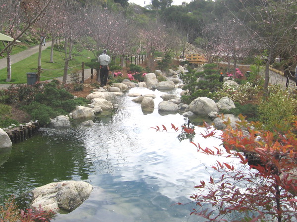 A sparkling man-made river runs through the canyon bottom, surrounded by a gorgeous landscape.