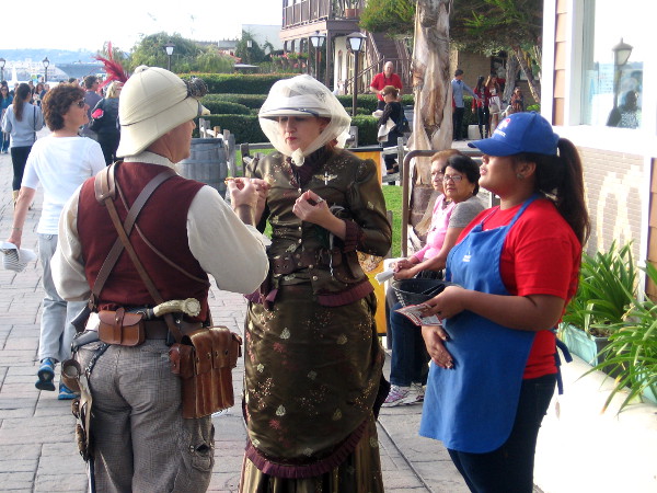 Two adults in historical costumes at Seaport Village. I don't know why!