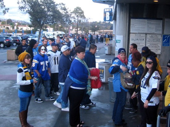A long line of people waited to enter Qualcomm Stadium to attend or watch the public hearing.