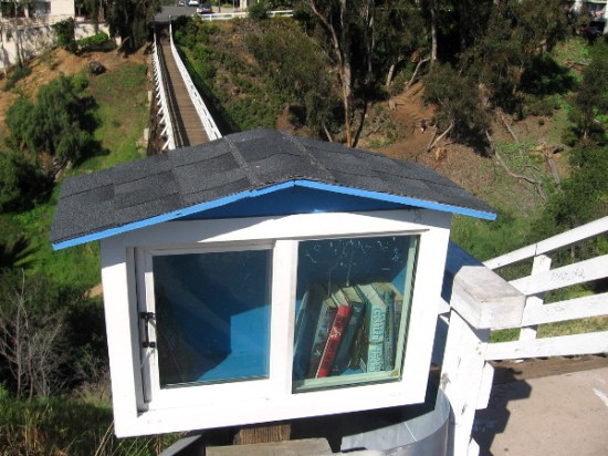 Small cabinet at end of footbridge contains books that people can freely borrow!