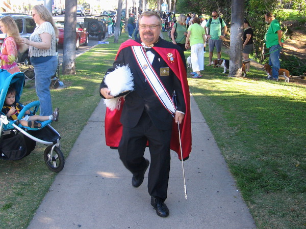 This smiling gentleman is dressed in the uniform of the Knights of Columbus.
