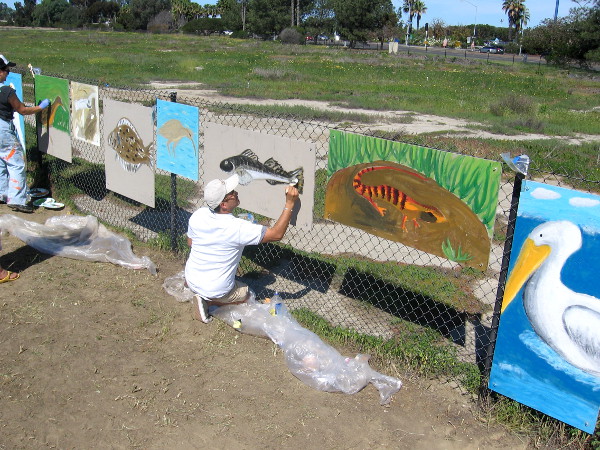 Adults were putting some finishing touches on cool public art.