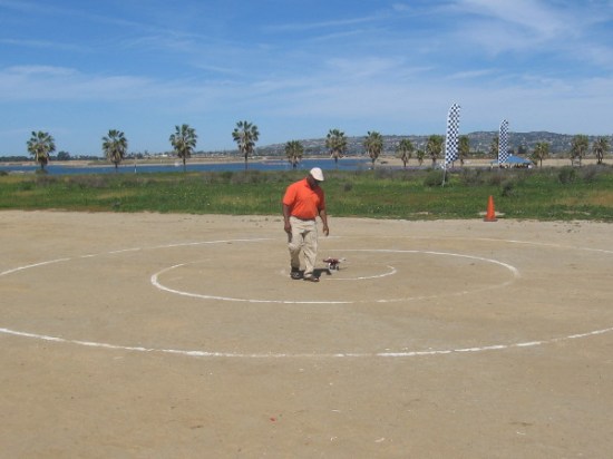 Guy sets his drone down in preparation for a demonstration.