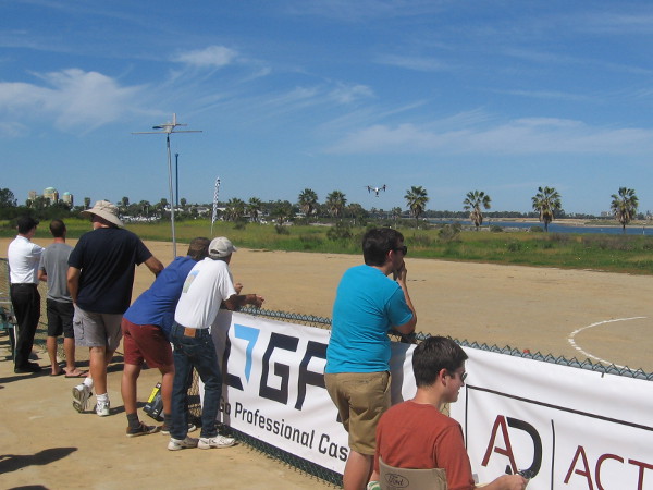 A crowd was watching the action. My camera barely captures one distant craft in flight.