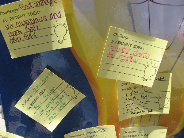 Kids left notes on a wall with their bright ideas.