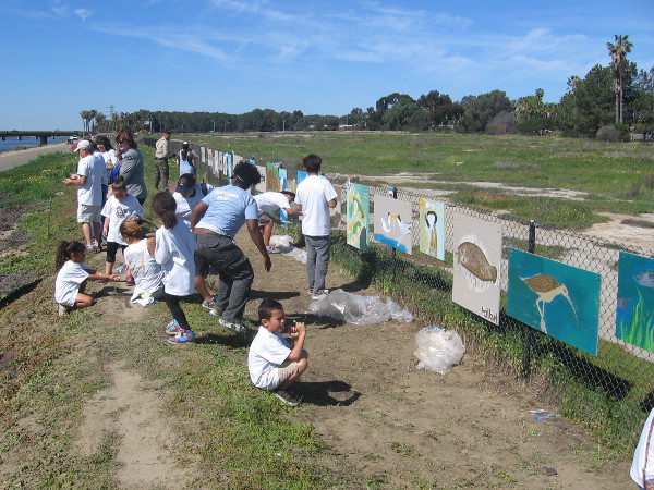 Lots of kids turned out to add life and color to a fence bordering nature's beauty.