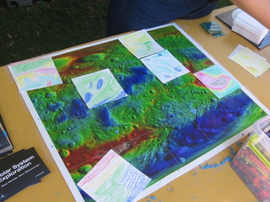 Young astronomers duplicate the colors of an enhanced surface image of asteroid Vesta.