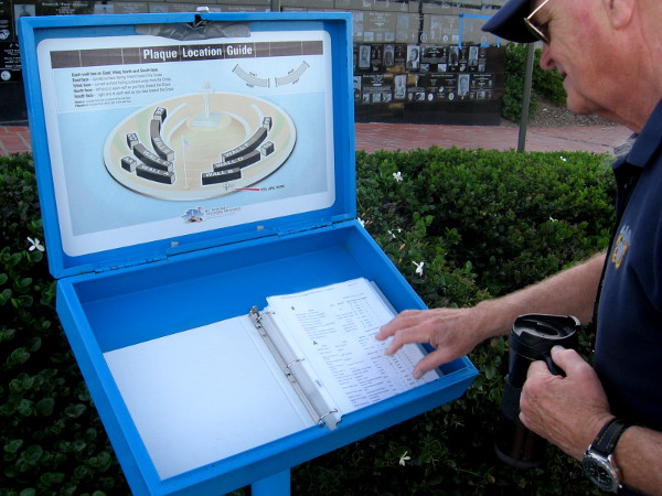 I'm shown an often updated book that lists the positions of every plaque by name.