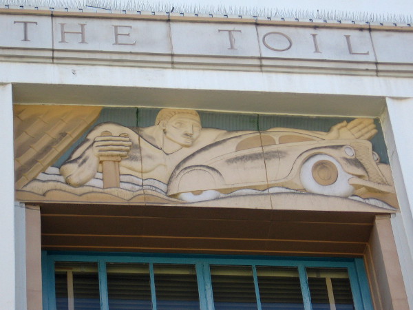 Classic automobile in Art Deco artwork in downtown San Diego.