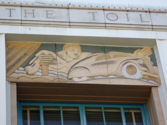 Classic automobile in Art Deco artwork in downtown San Diego.