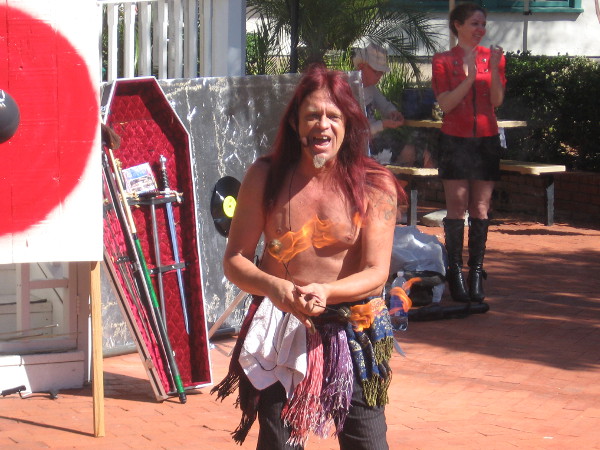 Murrugun the Mystic from AMC show Freakshow begins his busker festival danger act with fire eating.