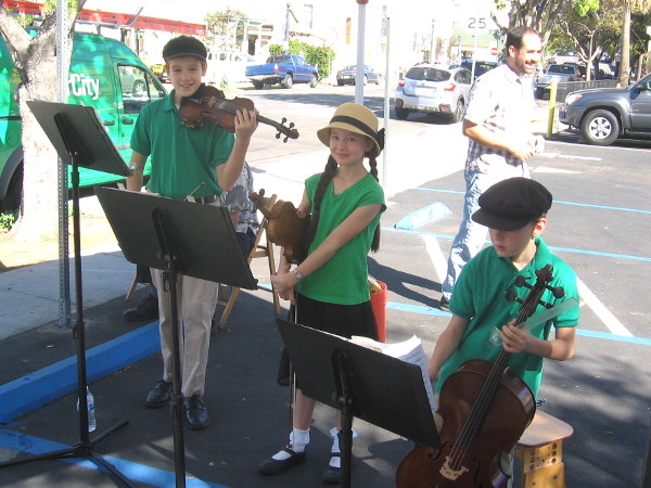 The musical family plays one Saturday at the Little Italy farmers market.