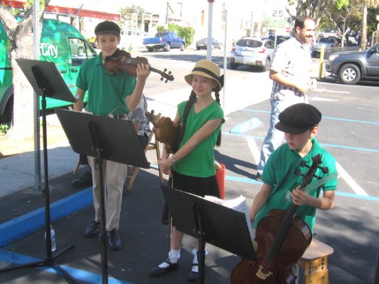 The musical family plays one Saturday at the Little Italy farmers market.