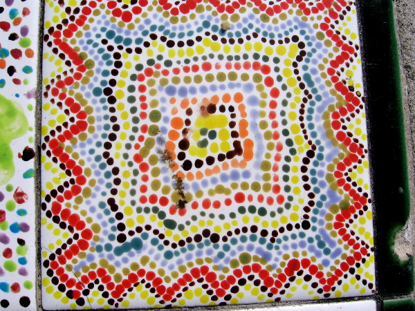 Fantastic tile artwork produced with many colorful painted dots.
