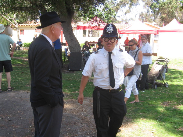 British bobby on patrol talks to a gentleman at unique Balboa Park event.