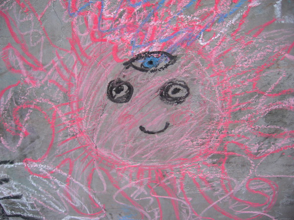 This bright, smiling chalk face is gifted with a third eye.