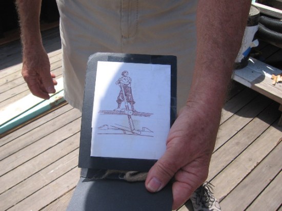 Sketch of helmsman steering the galleon with a vertical lever attached to the rudder's tiller. He had a window to look through in the aftcastle.