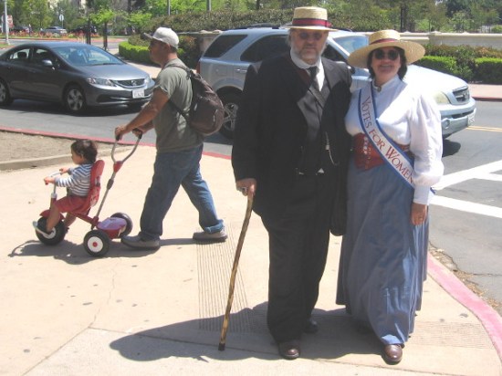 Many in historical costumes would reenact a political march in support of Votes For Women.