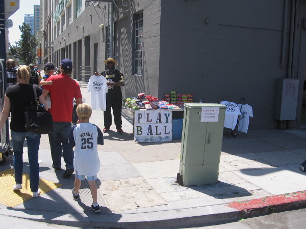This smiling entrepreneur set up shop on a sidewalk a couple blocks from Petco Park.