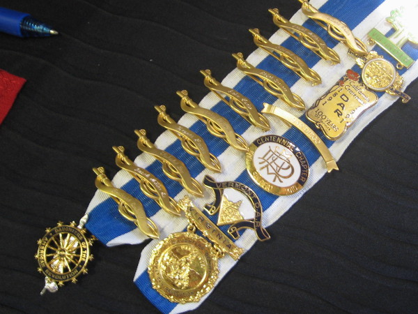 Pins and medals of all sorts. Some contain the names of patriotic relations.