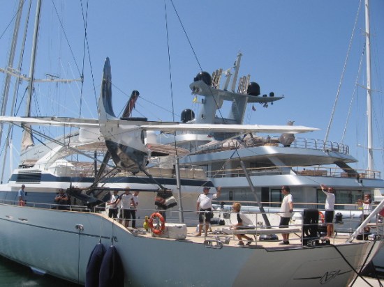 This tiny seaplane is about to be set on a super gigantic sailing ship!