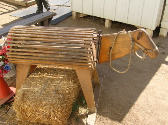 Is this one of the donkeys. Nope. Visitors and kids from local schools can sit on this wooden critter, because touching the live donkeys is not allowed.