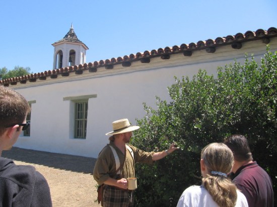 Tour guide shows native Lemonade Berry near Casa de Estudillo in Old Town.