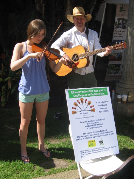 This smiling Dad and daughter musical duo was raising money to help build school gardens.
