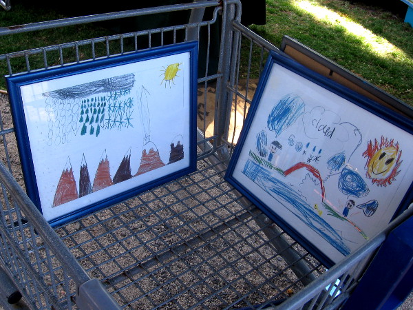 Kids' art shown at The Project Lennon table. The organization promotes peace and positive outlets for urban youth.