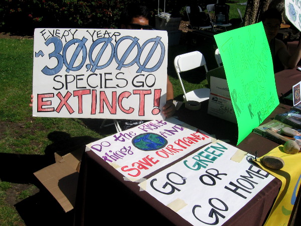 Sign states that every year 30,000 species go extinct.