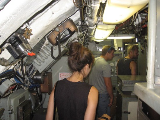 A group of visitors is entering the amazing Control Room, near the center of the USS Dolphin.