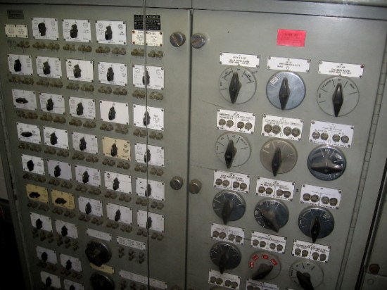 A panel with many complicated switches. In the Control Room, one can monitor the main storage batteries, generators and propulsion system.