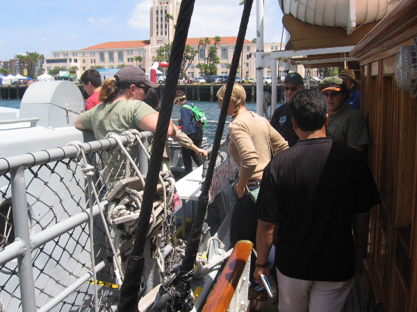 People board the Vietnam-era boat from the Maritime Museum's docked steam yacht Medea.