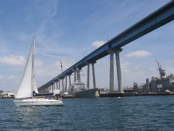 We pass a sailboat and begin under the Coronado Bay Bridge. We are approaching San Diego's very large, busy shipyards.