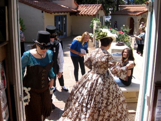A bustle of Victorian activity in front of the House of England cottage.