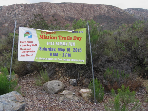 Banner beside Father Junipero Serra Trail announces Explore Mission Trails Day!