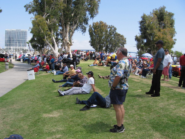 Corvette owners await to hear which cars win show awards.
