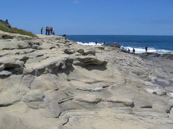 People love to walk across this rocky landscape right up to the sea cliffs to watch the surf.