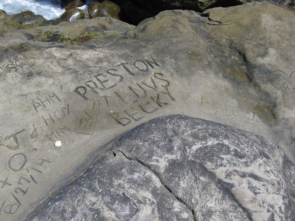Over the years many have carved names and messages in the soft sandstone.
