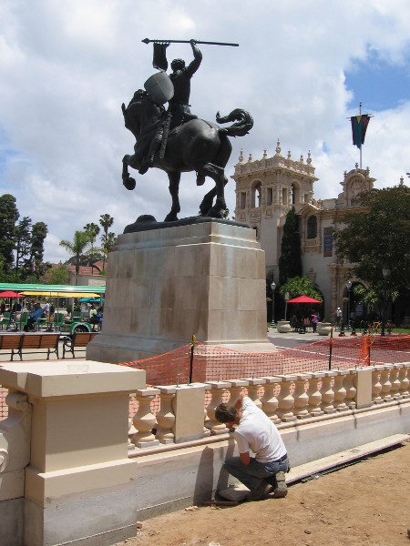 Guy working on restoring the balustrade next to the El Cid statue. The walkway will now be ADA accessible.