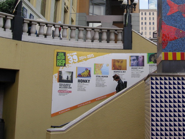 Musician heads down stairs toward entrance of the Lyceum Theater.